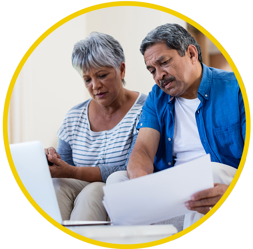 Over 50 years old couple reading social security disability paperwork